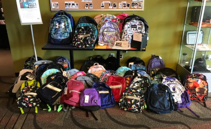 several backpacks in boston office, collected by employees